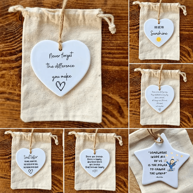 White glazed ceramic heart ornament, a thoughtful keepsake with an inspirational quote for any occasion.