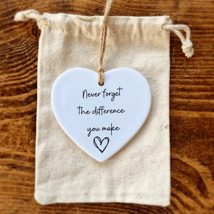 Small white ceramic heart ornament with a black inspirational quote, elegant and heartfelt sentimental gift.