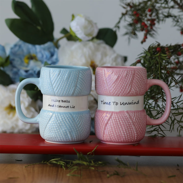 Unisex ceramic mug with a colorful knitting yarn ball design, perfect for crafters and coffee lovers.