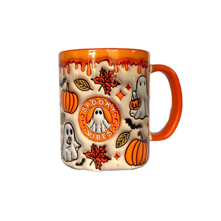 Empty decorative pumpkin coffee mug with ghost, ready for your favorite fall beverages or as a kitchen display.