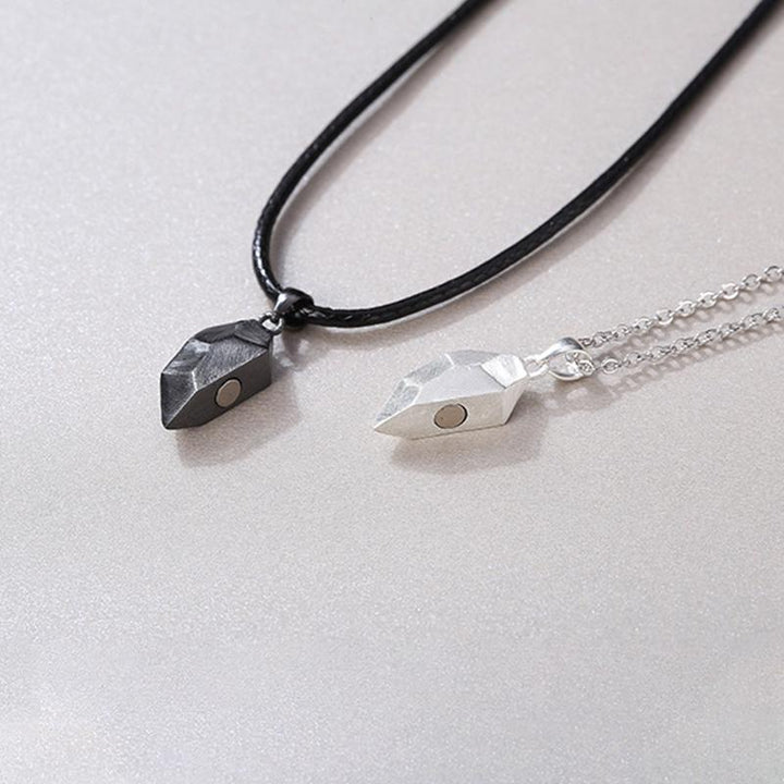 Matching alloy couple necklace featuring an interlocking heart pendant, unisex and symbolic jewelry
