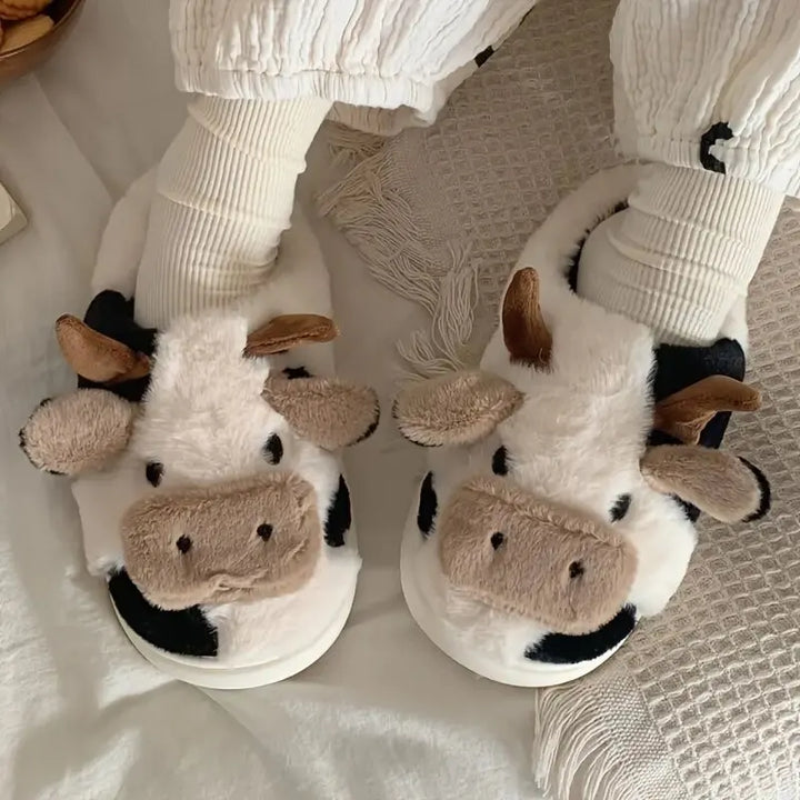 Cute black and white cow print plush slippers, funny unisex indoor footwear for cozy home comfort.
