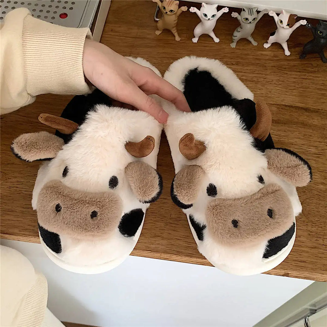 Pair of cozy unisex cow plush slippers, perfect indoor animal footwear for autumn & winter home comfort.