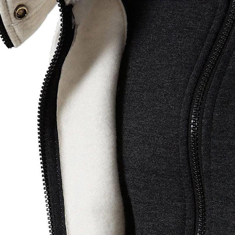 Stack of folded cozy unisex jackets in various neutral autumn colors