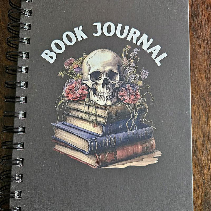 Unisex creative journal with a half-filled page, demonstrating its use with colorful watercolor pencils.