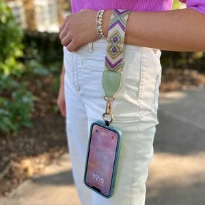 Portable phone strap with an integrated zipper pouch, ideal for universal phone compatibility and on-the-go use.