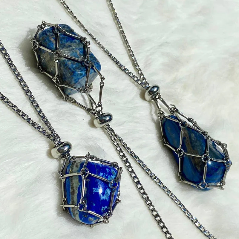 Close-up of a silver crystal cage pendant, intricate wire work detail, spiritual gift
