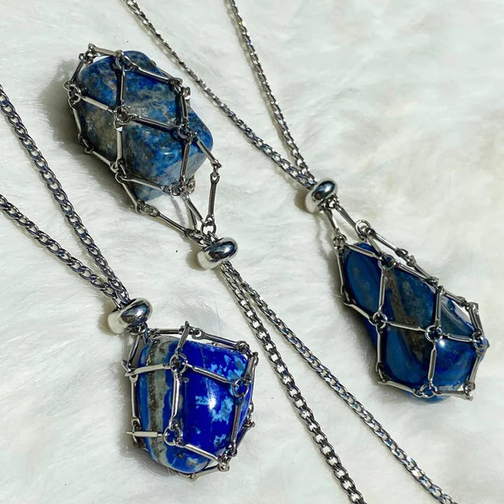 Close-up of a silver crystal cage pendant, intricate wire work detail, spiritual gift