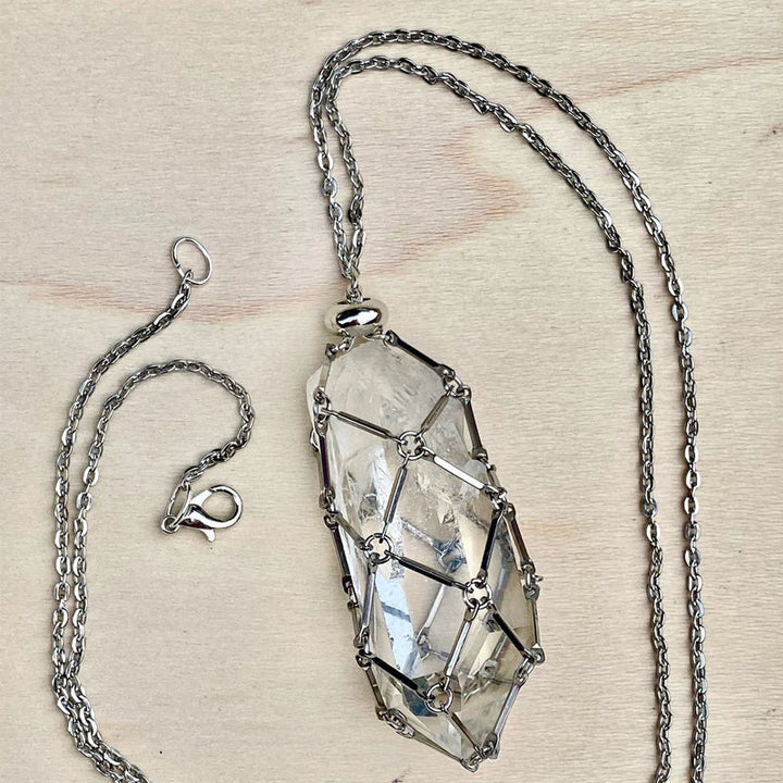 Unisex crystal cage pendant with a clear quartz crystal, energy healing accessory