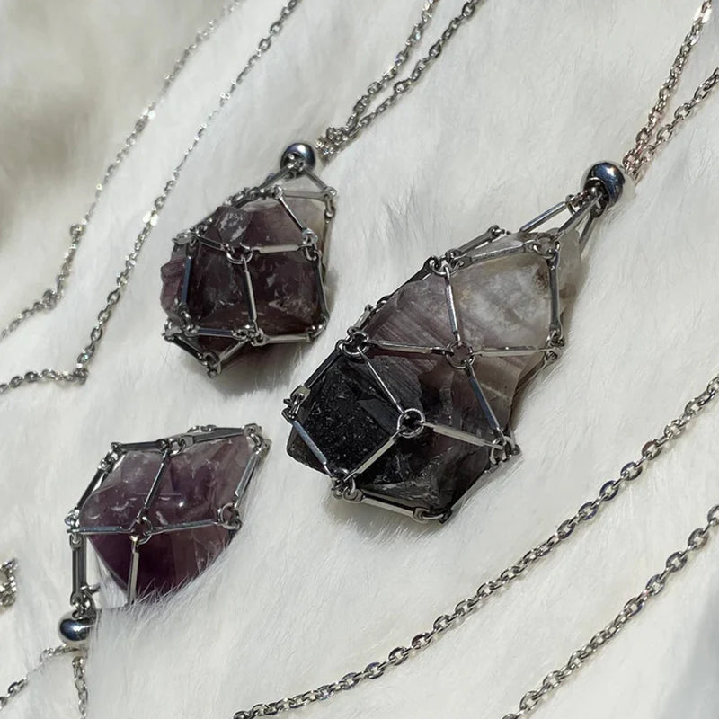 Gold crystal cage necklace holding a vibrant green aventurine stone, prosperity jewelry
