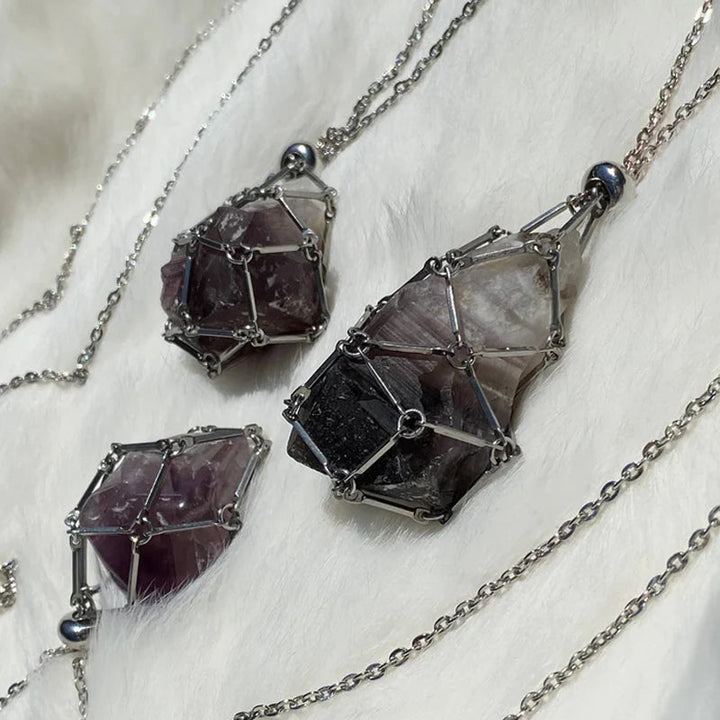Gold crystal cage necklace holding a vibrant green aventurine stone, prosperity jewelry