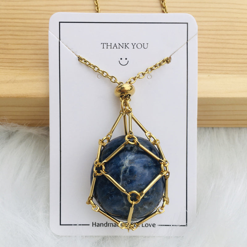 Silver crystal cage pendant with a small charm on the chain, personalized jewelry