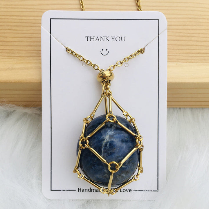 Silver crystal cage pendant with a small charm on the chain, personalized jewelry
