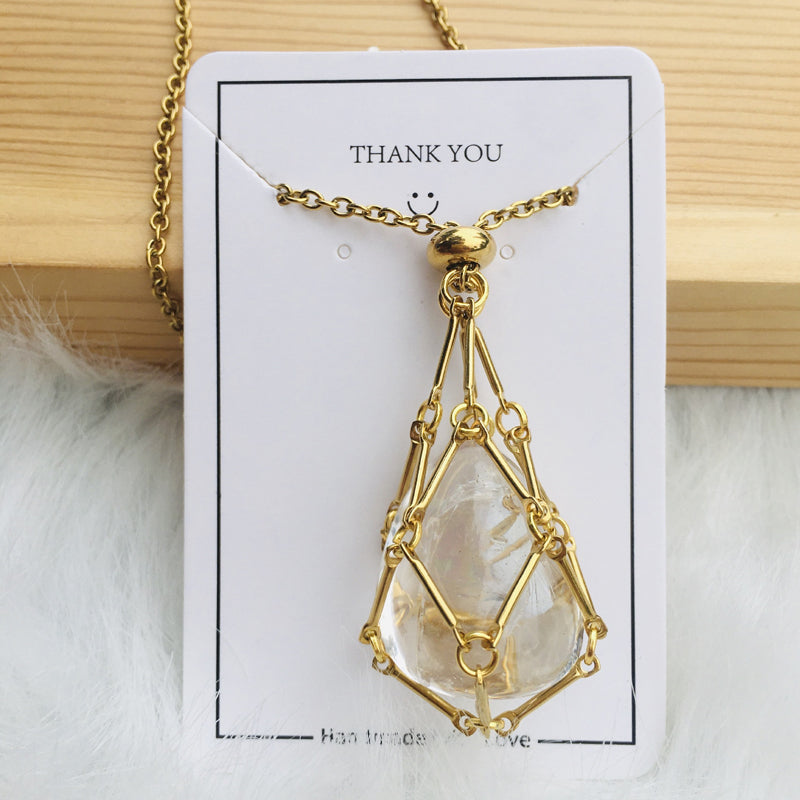 Gold crystal cage pendant, empty, displayed in a gift box, ready for presentation