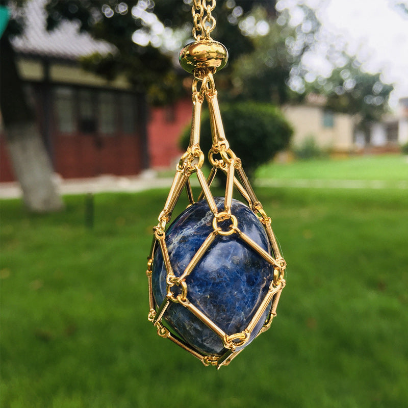 Unisex black metal crystal cage necklace, sleek design, ready for healing stones