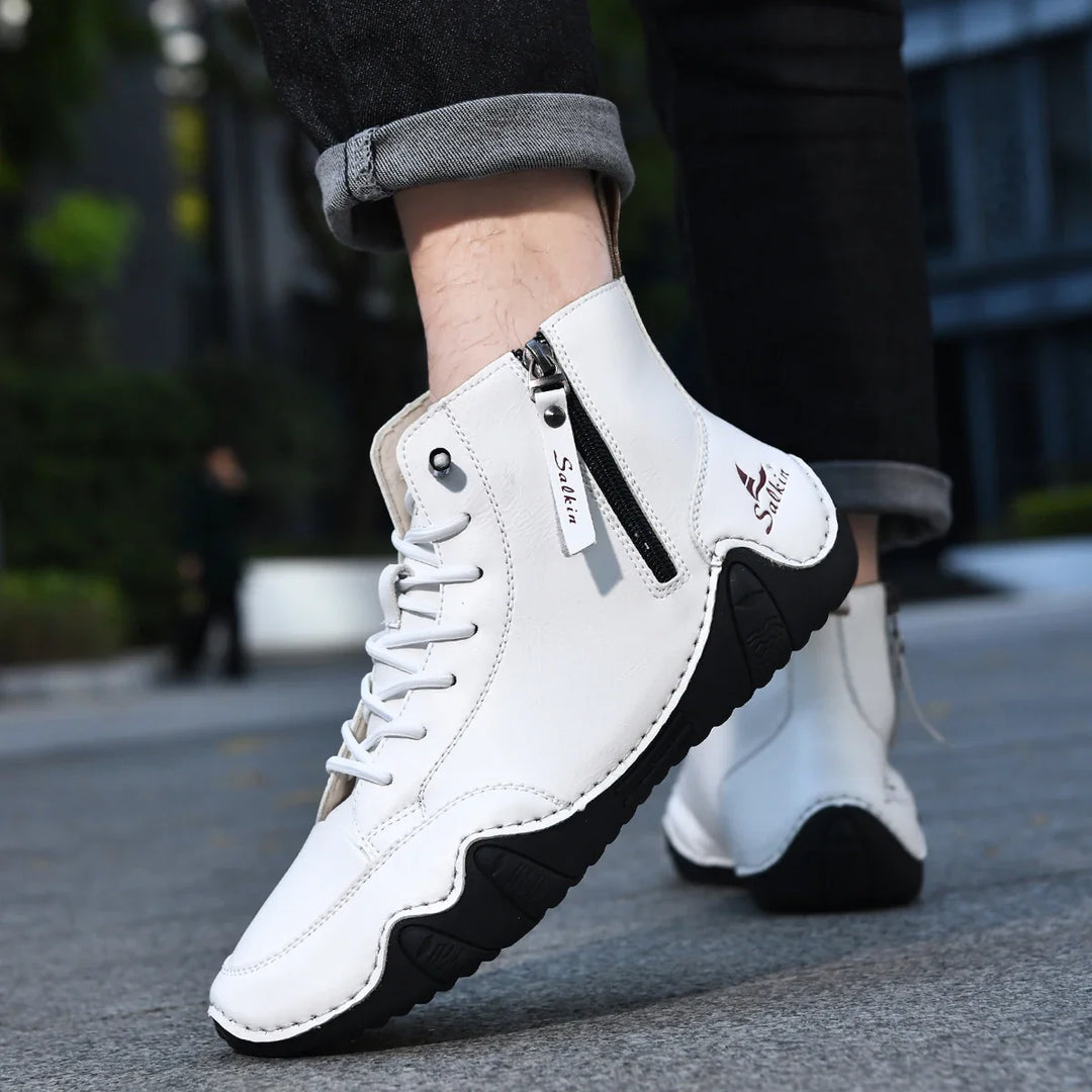 A person lacing up Unisex Orthopedic Zip Boots, demonstrating ease of wear and fit