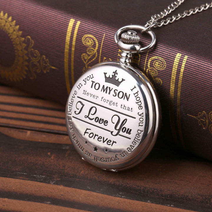 Detailed shot of the engraving on a gold quartz pocket watch, a cherished keepsake gift