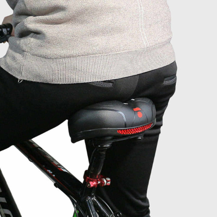 Waterproof unisex bicycle saddle for all-weather comfort. Ergonomic design for back & sit bone pain relief.