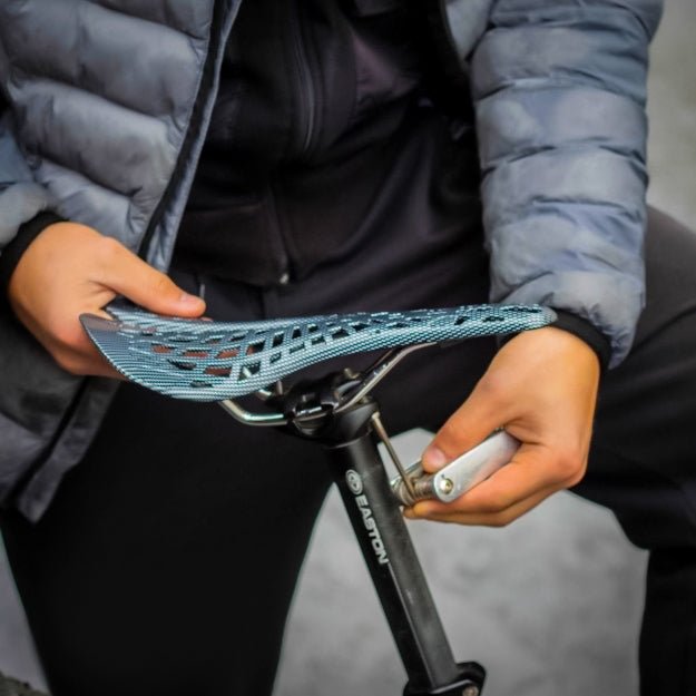 Durable unisex bicycle saddle for road, mountain, and commuter bikes. Ergonomic design ensures comfort & support.