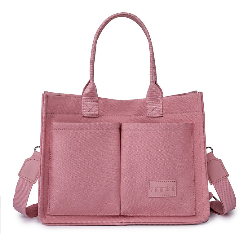 Unisex fashion canvas crossbody bag, featuring a classic design for long-lasting appeal.