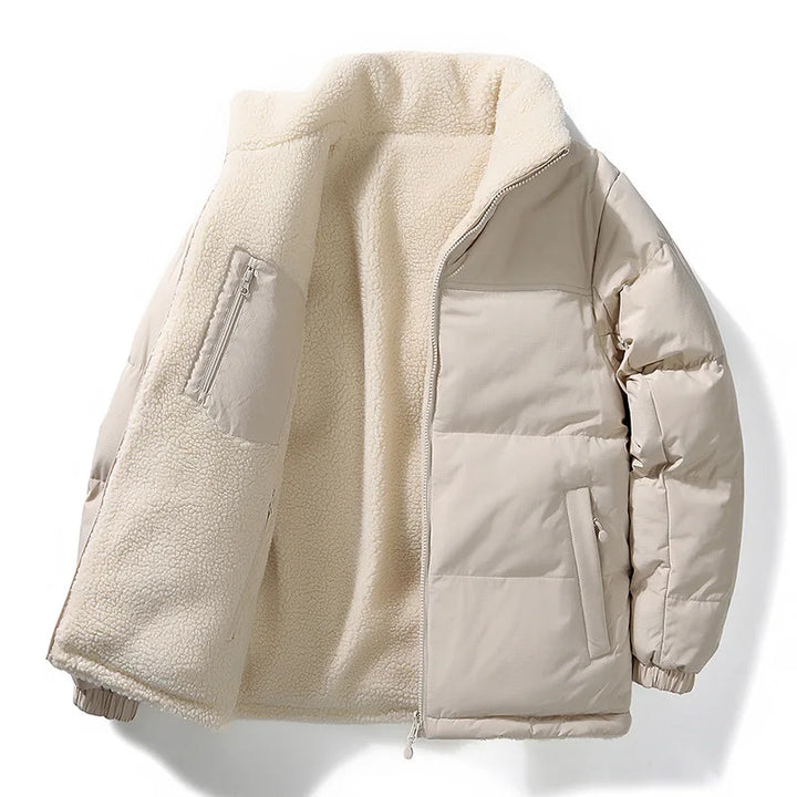 Unisex outerwear puffer jacket draped over a chair, highlighting its thick, warm fleece lining and style.