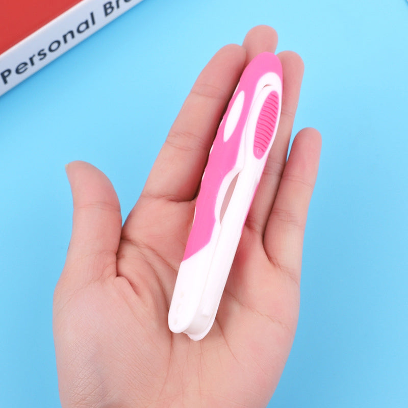 Set of multi-colored folding travel toothbrushes for family oral care and hygiene