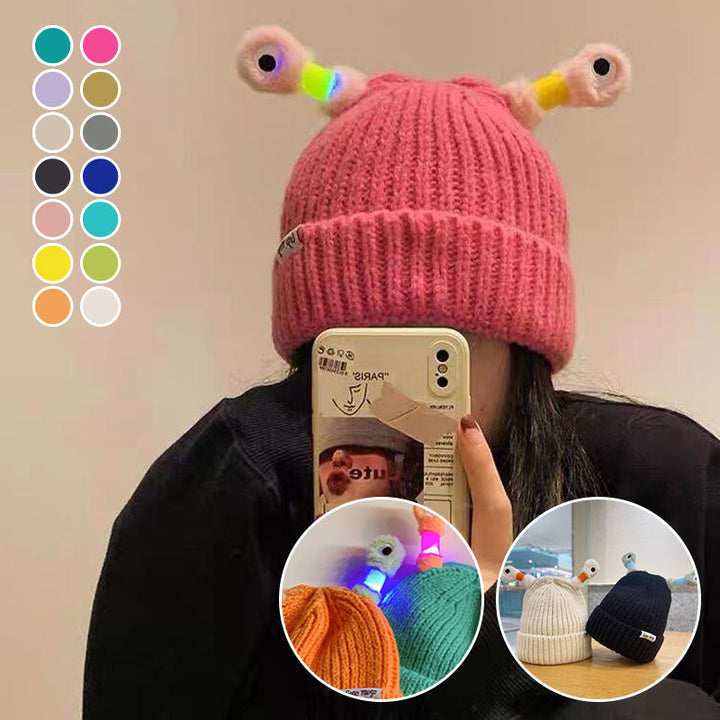 Child wearing a red Unisex Monster Beanie, expressing fun and warmth
