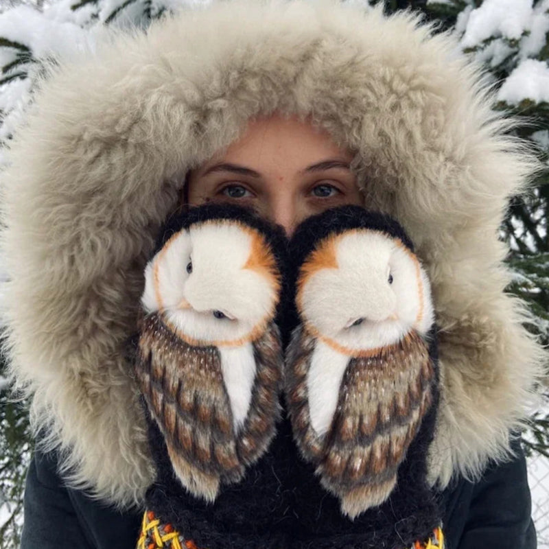 Close-up of cozy hand-knitted owl mittens, showcasing intricate Nordic design and soft cashmere yarn