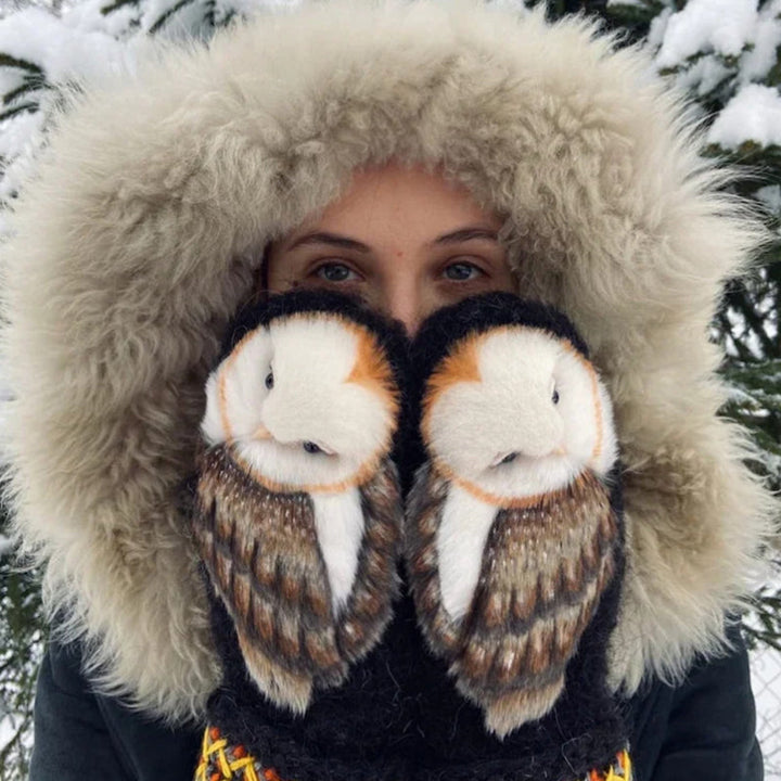 Close-up of cozy hand-knitted owl mittens, showcasing intricate Nordic design and soft cashmere yarn
