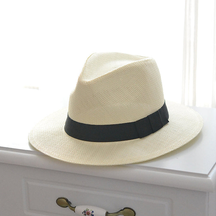 Elegant straw Panama hat, hand-knitted, offering UPF 50+ sun protection for any outdoor activity.