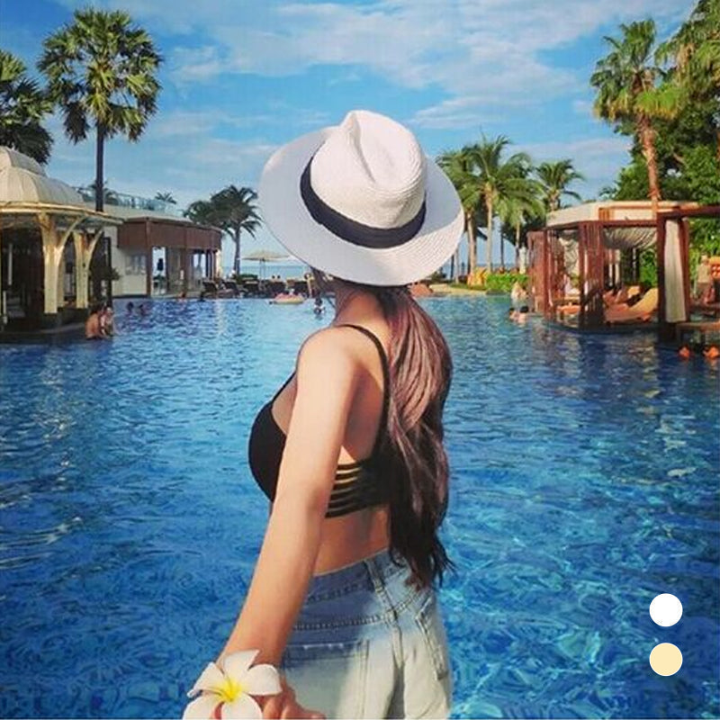 A person wearing a unisex hand-knitted Panama sun hat with UPF 50+ protection, enjoying the outdoors.