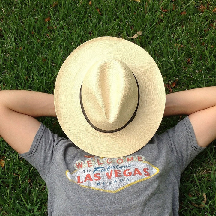 Headwear featuring a unisex hand-knitted straw Panama hat, providing essential UPF 50+ UV protection.