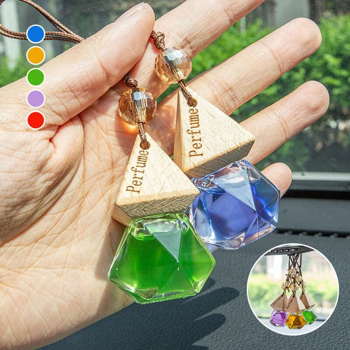 Close view of a hanging car air freshener vial, showing textured cap, premium auto accessory & car decor