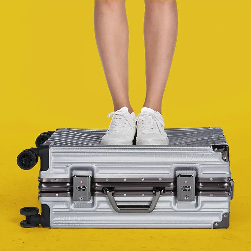 Unisex hard shell suitcase with durable aluminum frame, secure lock, and spinner wheels for easy travel.