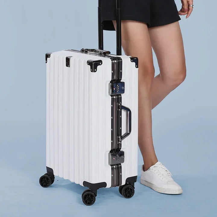 Sleek hard shell suitcase, unisex, with a protective aluminum frame and integrated secure lock for travel.