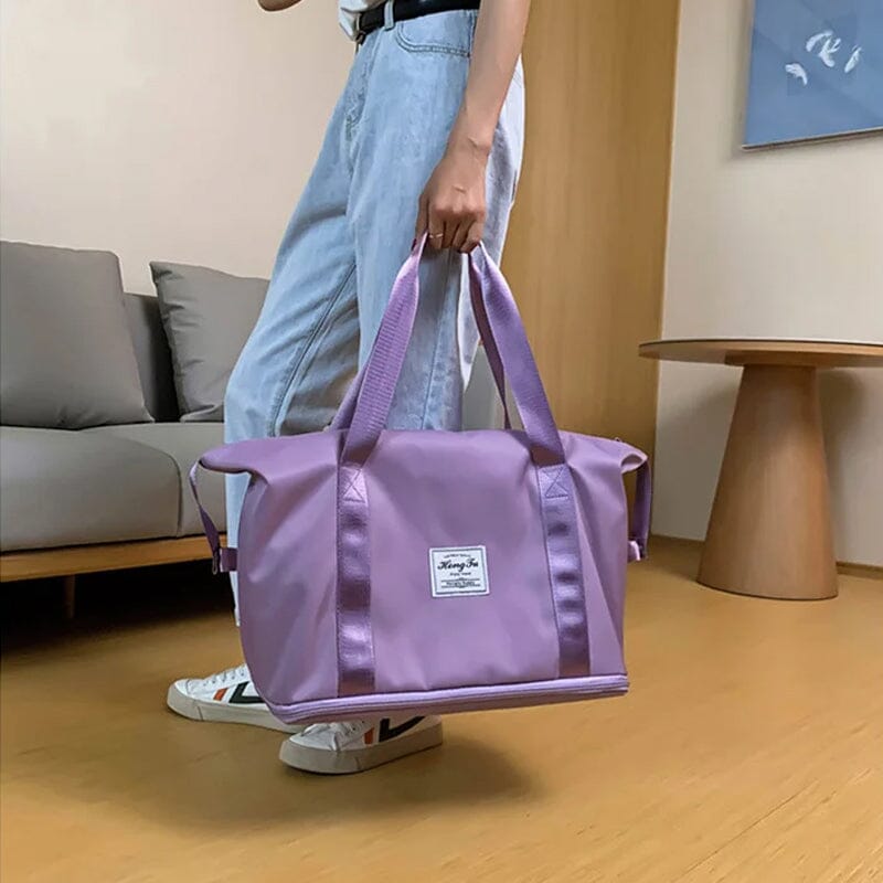 Black unisex duffel bag, designed for efficient travel and sports, with wet/dry separation