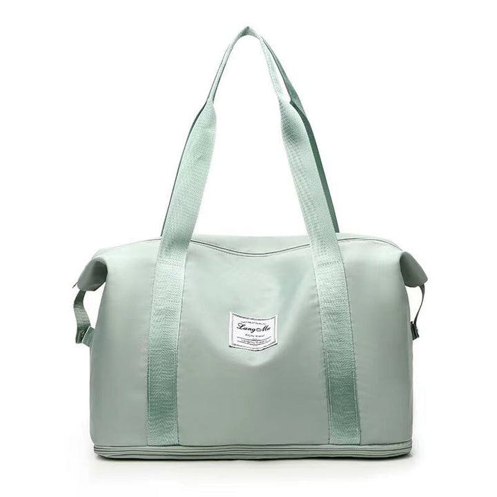 Fashionable duffel bag in a dark grey, offering ample space and specialized sections