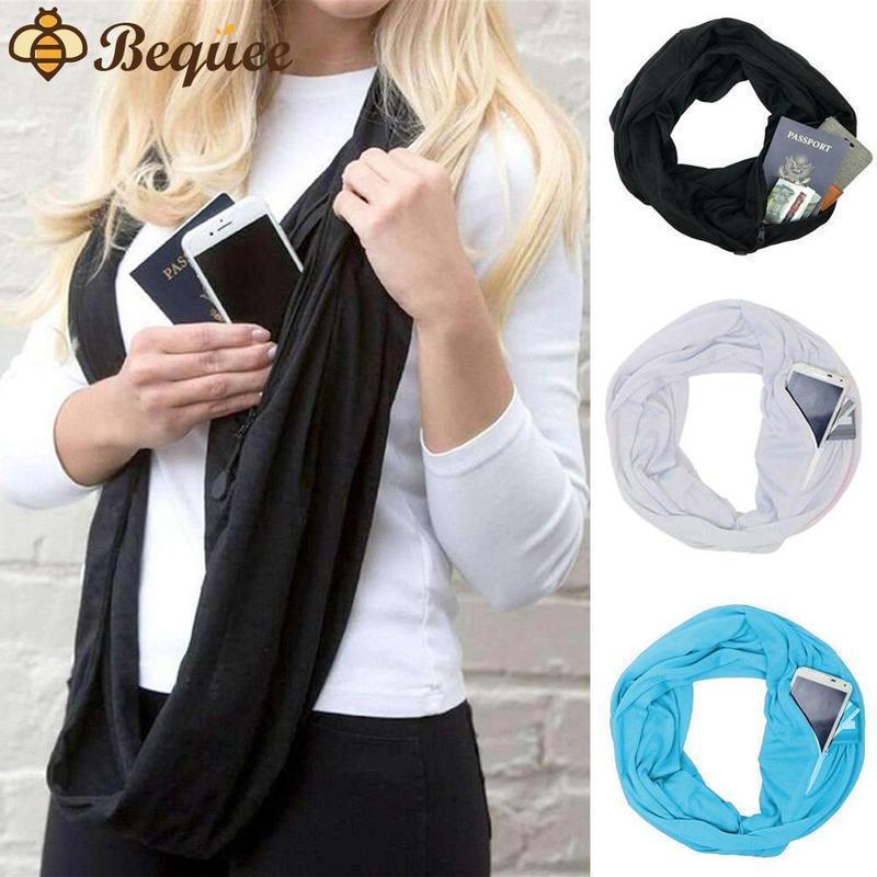 Unisex infinity scarf with hidden zipper pocket. Black with gold chain print.
