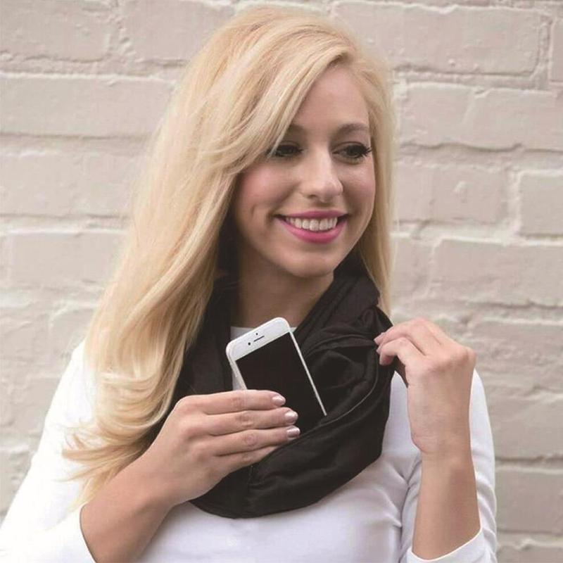 Close-up of infinity scarf showing hidden zipper pocket and soft polyester fabric.