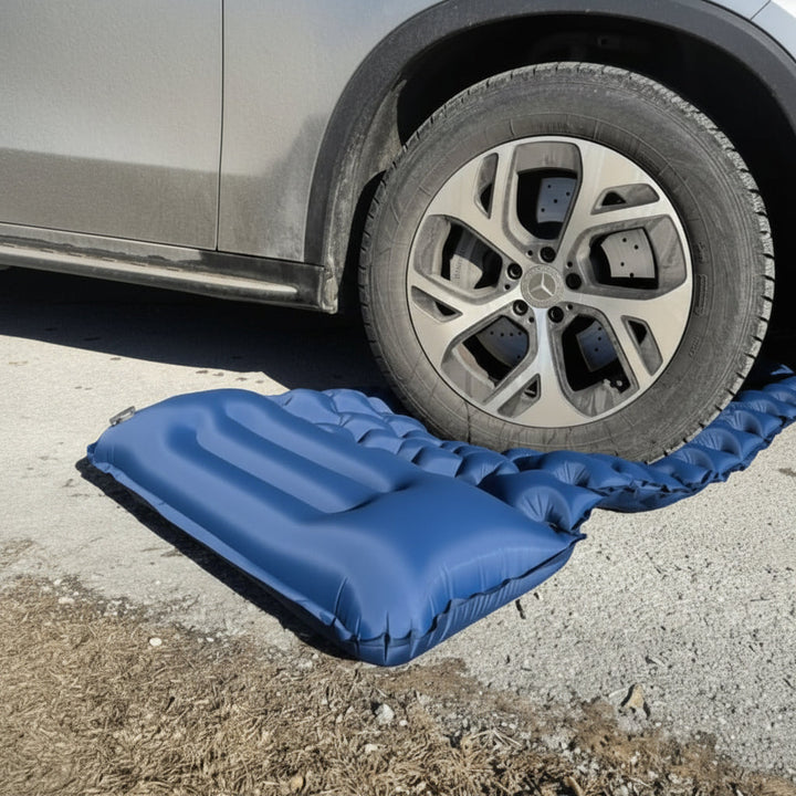 Inflatable camping mattress featuring a built-in foot pump for effortless, quick inflation. Essential backpacking gear.
