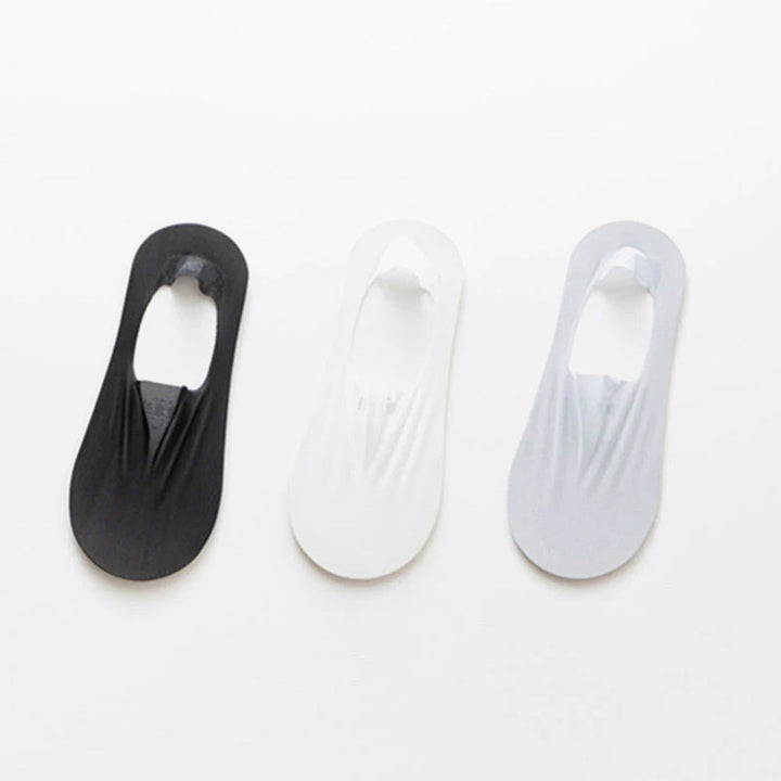 Unisex invisible socks paired with casual shoes, showcasing their no-show appeal