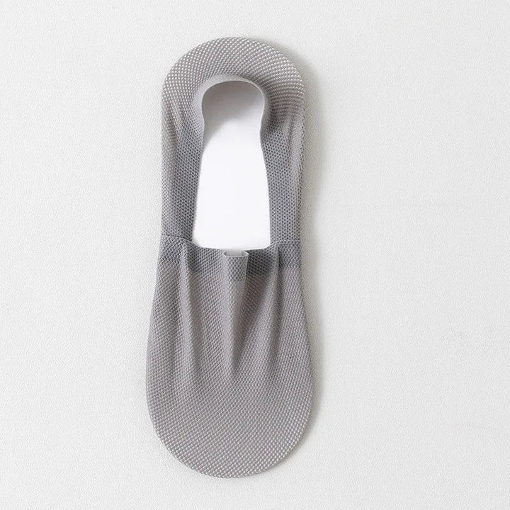 Discreet low-cut no-show socks with anti-slip silicone, perfect for various shoe styles.