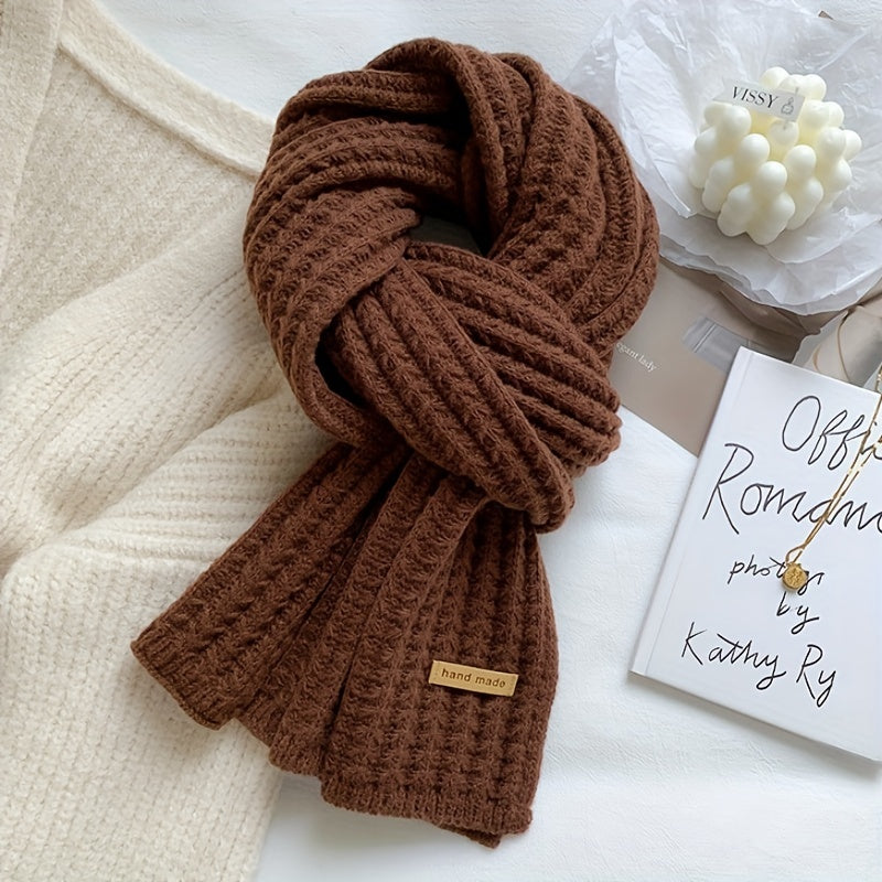Essential unisex autumn-winter accessory: a warm, breathable knitted scarf with a geometric pattern.