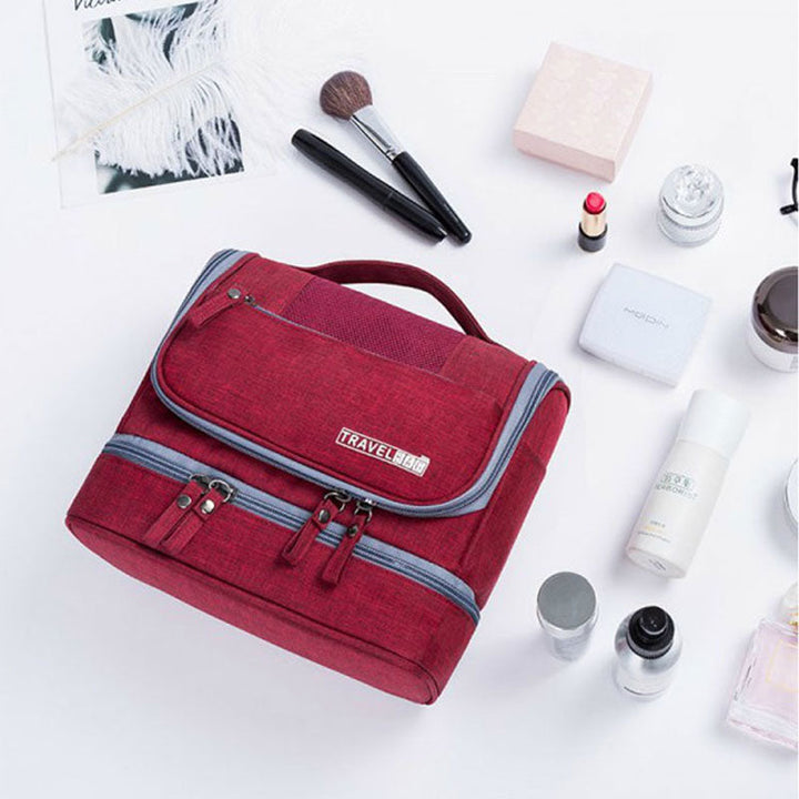 Large hanging toiletry bag with hook, multi-compartment travel organizer for easy access to essentials.
