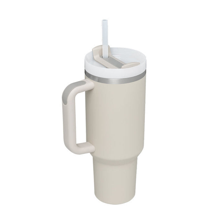 Kitchen essential: insulated mug with handle & straw for versatile drink storage.