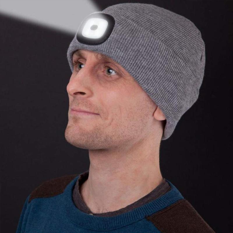 Person wearing a blue LED knitted winter beanie hat during an evening jog, hands-free illumination