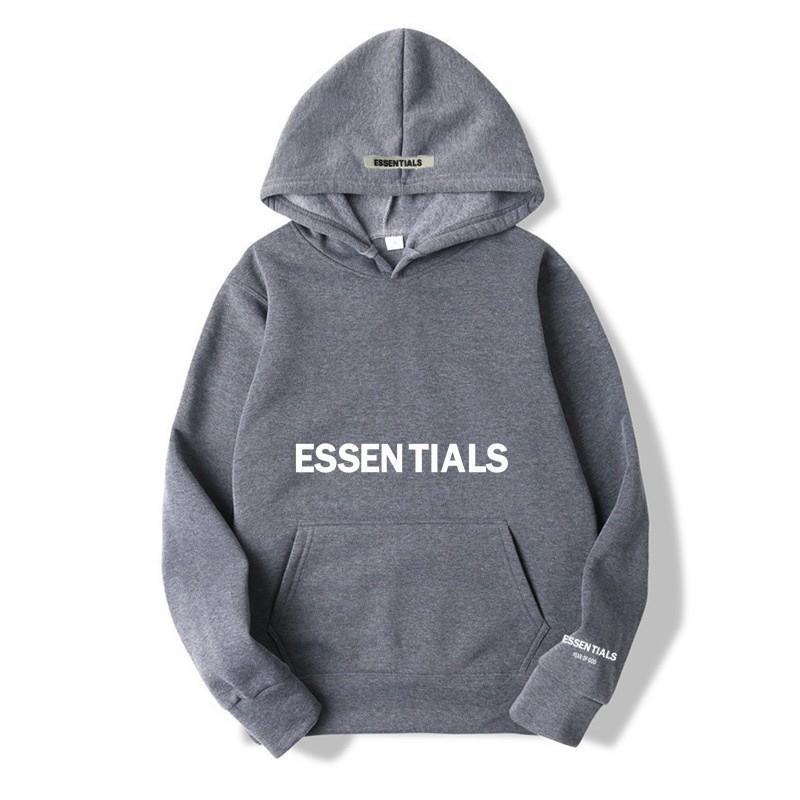 Close-up of letter print on a cozy unisex pullover hoodie, perfect for casual street style.