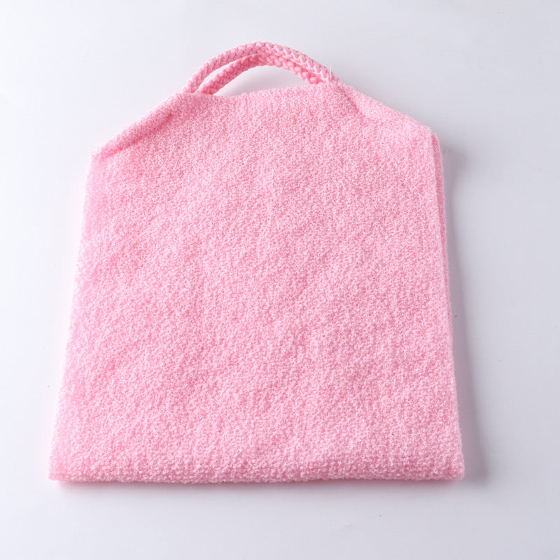 Person using a long handle back scrubber towel to reach upper back, personal care