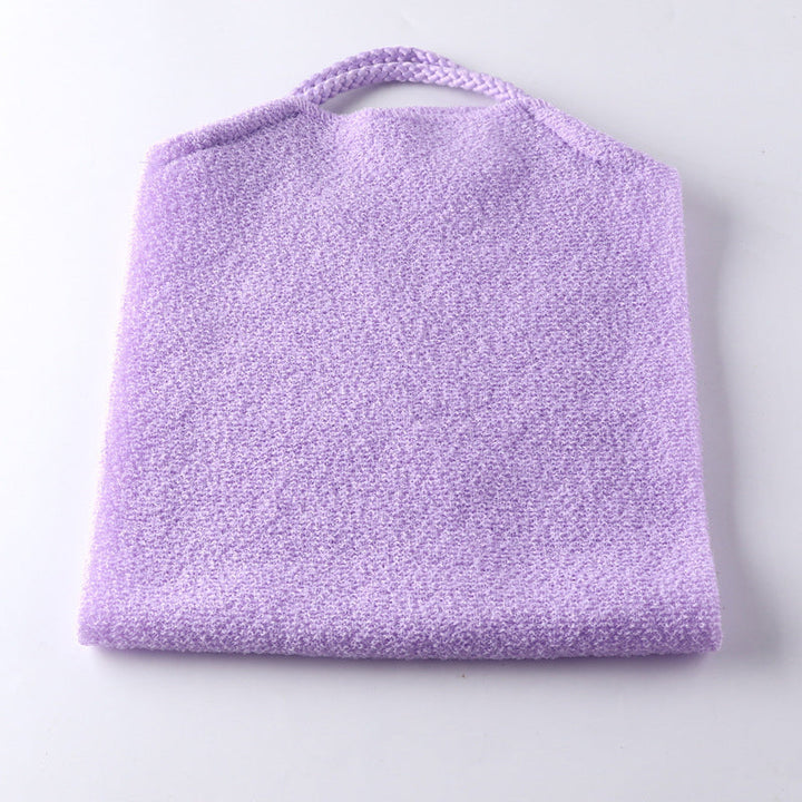 Exfoliating back scrubber towel drying on a rack, an essential bathroom accessory