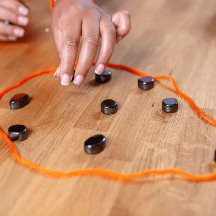 Compact magnetic chess travel game in play, a challenging strategy board game for kids, adults, & family trips.
